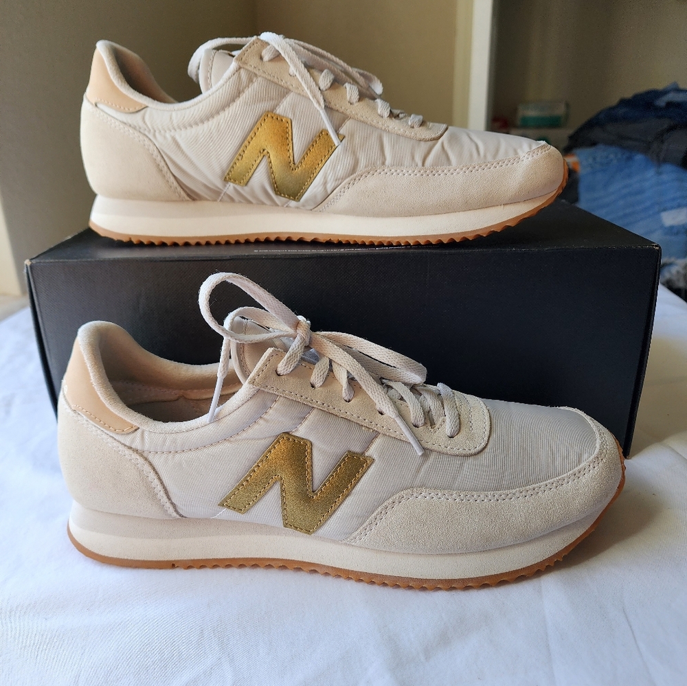 New Balance 720 gold and white sneakers